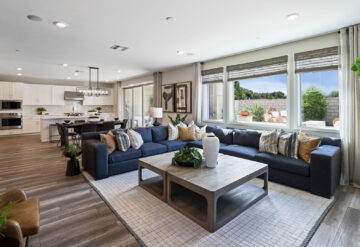 Lennar open concept living room with blue sectional sofa