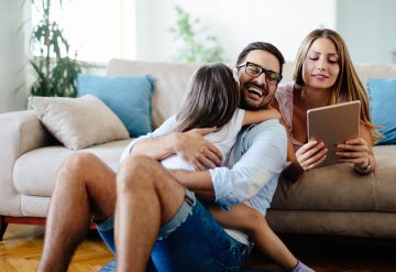 family at home on the sofa