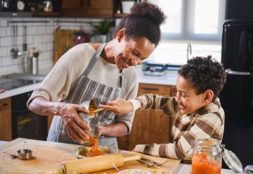 Mother and son baking together