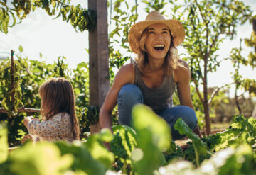 happy gardener and child outside