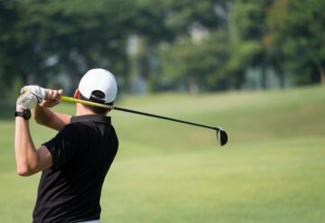 man swinging a golf club